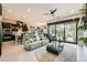 Open concept living area with a modern kitchen and a sliding glass door to the backyard at 7473 Deschutes Cir, Las Vegas, NV 89129