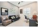 Cozy office featuring natural light, a futon, comfortable chair, and modern decor at 7473 Deschutes Cir, Las Vegas, NV 89129