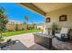 Inviting outdoor patio with comfortable seating, lush landscaping, and a serene atmosphere at 7473 Deschutes Cir, Las Vegas, NV 89129