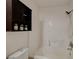 Bright bathroom featuring a shower over bath and storage at 7709 Sierra Paseo Ln, Las Vegas, NV 89128