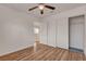 A bedroom with wood floors, closet and door to outside at 7709 Sierra Paseo Ln, Las Vegas, NV 89128