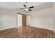 The light-filled bedroom features a barn door and wood laminate flooring at 7709 Sierra Paseo Ln, Las Vegas, NV 89128