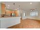 Modern kitchen with stainless steel appliances, wood cabinetry, granite countertops and an open layout at 7709 Sierra Paseo Ln, Las Vegas, NV 89128