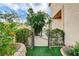 Side yard with an iron archway and garden at 7709 Sierra Paseo Ln, Las Vegas, NV 89128