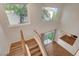 Staircase features wood flooring and a sliding glass door at 7709 Sierra Paseo Ln, Las Vegas, NV 89128