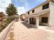 Spacious backyard featuring a covered patio and a separate gazebo with a brick-paved courtyard at 7851 Tidal Pool Ct, Las Vegas, NV 89139