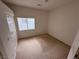 Simple bedroom with natural light, closet, and neutral colors at 7851 Tidal Pool Ct, Las Vegas, NV 89139