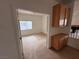 Bedroom view with closet and window; built-in cabinet in hallway at 7851 Tidal Pool Ct, Las Vegas, NV 89139
