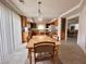 Warm dining area featuring wood table, chairs, and natural light at 7851 Tidal Pool Ct, Las Vegas, NV 89139