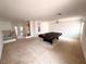 This game room features a pool table, ceiling fan, and carpet flooring at 7851 Tidal Pool Ct, Las Vegas, NV 89139