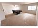 This room features a pool table, ceiling fan, and large window at 7851 Tidal Pool Ct, Las Vegas, NV 89139