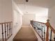 The hallway features a staircase with wooden banisters and carpet flooring at 7851 Tidal Pool Ct, Las Vegas, NV 89139