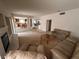 Comfortable living room with fireplace and casual seating arrangement at 7851 Tidal Pool Ct, Las Vegas, NV 89139