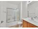 Bathroom featuring a shower with glass doors and a single sink at 7908 House Sparrow St, North Las Vegas, NV 89084