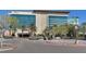 Hotel exterior featuring modern architecture, palm trees, and convenient parking at 7908 House Sparrow St, North Las Vegas, NV 89084