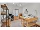 Bright office space with shelves and two wooden desks at 7908 House Sparrow St, North Las Vegas, NV 89084