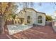 Two-story home with covered patio, mature trees, and a low-maintenance landscaped backyard at 8113 Bay Springs Dr, Las Vegas, NV 89128