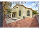 Two story home featuring backyard, covered patio, large arched windows, and low-maintenance landscaping at 8113 Bay Springs Dr, Las Vegas, NV 89128