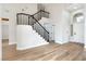 The entryway features hardwood floors, staircase with iron railing, and an arched window at 8113 Bay Springs Dr, Las Vegas, NV 89128