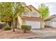 Charming two-story home with a two-car garage and mature landscaping at 8113 Bay Springs Dr, Las Vegas, NV 89128