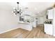 Bright kitchen featuring a large island, modern lighting, and stainless steel appliances at 8113 Bay Springs Dr, Las Vegas, NV 89128
