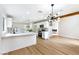 Open kitchen with an island, modern appliances, and a view into the dining area and living room at 8113 Bay Springs Dr, Las Vegas, NV 89128