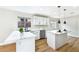 Well-lit kitchen with an island, stainless steel appliances, and white cabinetry at 8113 Bay Springs Dr, Las Vegas, NV 89128