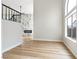 View of the living room with marble fireplace, wood floors, and a staircase at 8113 Bay Springs Dr, Las Vegas, NV 89128