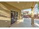 An outdoor patio with a sliding glass door and concrete flooring at 8113 Bay Springs Dr, Las Vegas, NV 89128