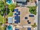 Aerial view of a home with solar panels, a pool, and a landscaped yard at 8217 Fritzen Ave, Las Vegas, NV 89131