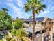 Rear view of the home with solar panels, patio cover, and desert landscaping at 8217 Fritzen Ave, Las Vegas, NV 89131