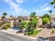 Inviting two-story home featuring well-manicured landscaping, a two-car garage, and solar panels on the roof at 8217 Fritzen Ave, Las Vegas, NV 89131