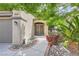 Inviting front entrance with a well-kept walkway, beautiful plants, and a charming front door at 8217 Fritzen Ave, Las Vegas, NV 89131