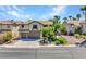 Inviting two-story house with a neat lawn, desert landscaping, and a spacious driveway at 8217 Fritzen Ave, Las Vegas, NV 89131