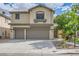 Well-maintained home showcasing a two-car garage, mature landscaping, and a classic exterior design at 8217 Fritzen Ave, Las Vegas, NV 89131