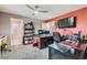 Functional home office with a ceiling fan, dual monitors, shelving, and carpeted floors at 8217 Fritzen Ave, Las Vegas, NV 89131