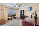 Dedicated office space with a large desk, comfortable seating, natural light, and carpeted floors at 8217 Fritzen Ave, Las Vegas, NV 89131