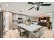 Open kitchen concept with stainless appliances, an island with seating, and a seamless flow into the living area at 8217 Fritzen Ave, Las Vegas, NV 89131