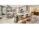 Modern kitchen with grey cabinets, stainless steel appliances, and a center island with bar seating at 8217 Fritzen Ave, Las Vegas, NV 89131