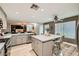 Bright kitchen with stainless steel appliances, an island with seating, and open floor plan at 8217 Fritzen Ave, Las Vegas, NV 89131