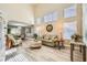Bright, open living area with wood floors, high ceilings, lots of light, and open to the dining area at 8217 Fritzen Ave, Las Vegas, NV 89131