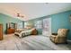 Spacious main bedroom features a walk-out, sitting area, carpet flooring, and a ceiling fan at 8217 Fritzen Ave, Las Vegas, NV 89131
