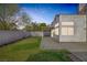 Lush backyard with green grass, a patio area, and mature landscaping for a private outdoor retreat at 8228 Lauderdale Ct, Las Vegas, NV 89128