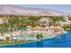 Stunning lakeside beach with sandy shorelines, inviting cabanas, and mountain views in the background at 8228 Lauderdale Ct, Las Vegas, NV 89128