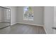A naturally lit bedroom has a mirrored closet and a large window with views at 8228 Lauderdale Ct, Las Vegas, NV 89128