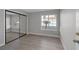 Bright bedroom features a large window with neighborhood views and a mirrored closet at 8228 Lauderdale Ct, Las Vegas, NV 89128