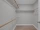 Walk-in closet with custom wood shelving and ample storage, plus modern laminate flooring at 8228 Lauderdale Ct, Las Vegas, NV 89128