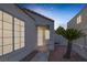 Close-up of a well-lit front porch with secure iron screen door at 8228 Lauderdale Ct, Las Vegas, NV 89128