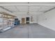 Spacious garage features shelving for storage and an overhead light at 8228 Lauderdale Ct, Las Vegas, NV 89128