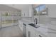 Bright kitchen featuring stainless appliances, modern white cabinetry, and quartz countertops at 8228 Lauderdale Ct, Las Vegas, NV 89128